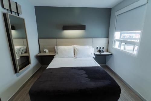 Cama o camas de una habitación en HOTEL LEMON GREEN -Zona Expo Frente al Centro de Convenciones