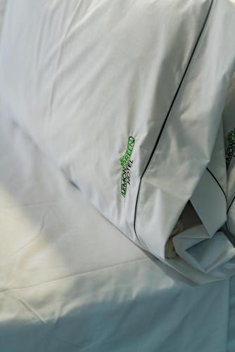 Cama o camas de una habitación en HOTEL LEMON GREEN -Zona Expo Frente al Centro de Convenciones