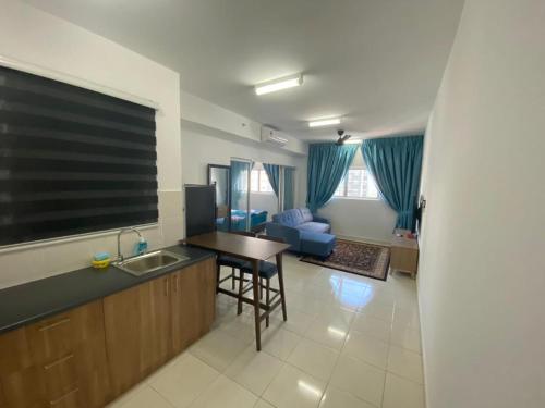 a kitchen and living room with a large flat screen tv at KLIA KLIA2 Alanis Sepang Putrajaya Cyberjaya Nilai by 3SIBS in Sepang