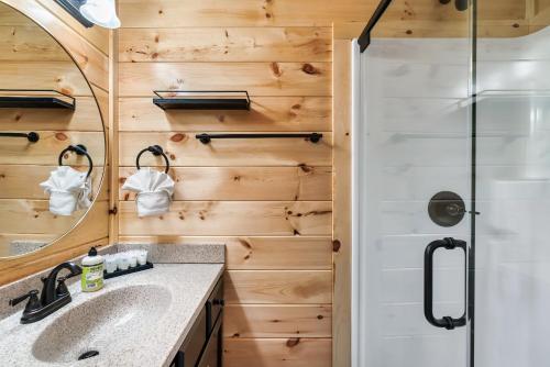 a bathroom with a shower and a sink at The Heritage in Pigeon Forge