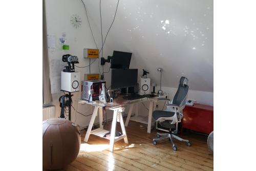 a room with a desk with a computer and two chairs at Private Apartment in Hannover