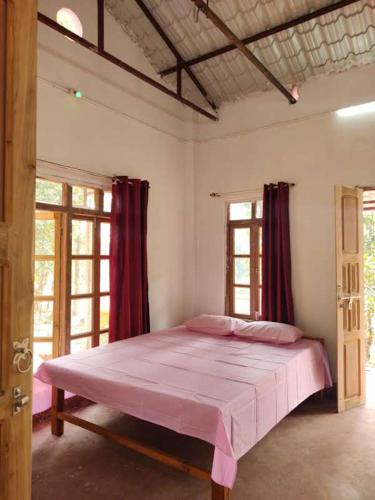 Katil atau katil-katil dalam bilik di Kurchi Homestay