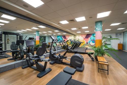 a gym with treadmills and elliptical machines at Royal Garden by Isrotel Collection in Eilat