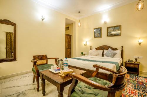 Postel nebo postele na pokoji v ubytování Tripli Hotels Shiv Villas