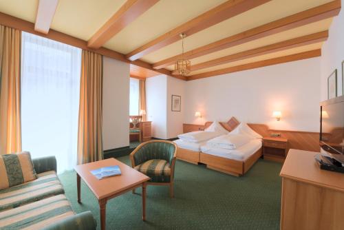 Postel nebo postele na pokoji v ubytování Hotel Post