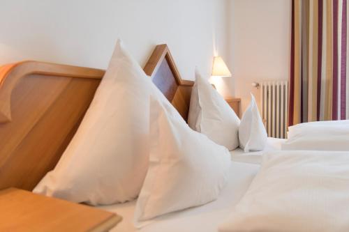 Postel nebo postele na pokoji v ubytování Hotel Post