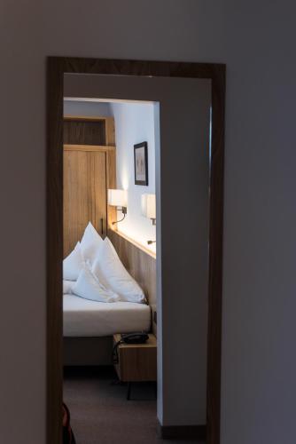 Postel nebo postele na pokoji v ubytování Hotel Post