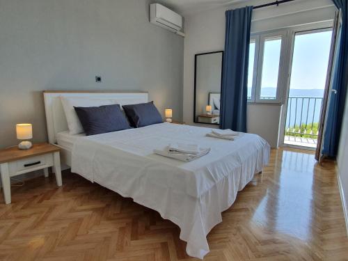 Posteľ alebo postele v izbe v ubytovaní Apartman Oneum