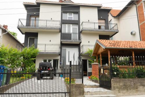 a house with a jeep parked in front of it at Sobe Jovan in Soko Banja