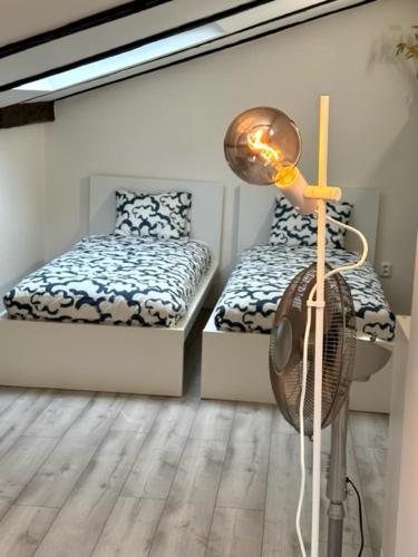 Postel nebo postele na pokoji v ubytování Apartmány LUXOR