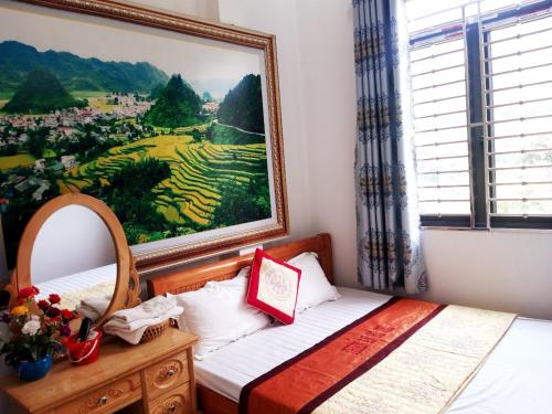 Ένα ή περισσότερα κρεβάτια σε δωμάτιο στο Thien An Guest House