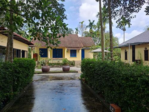 a house with a driveway in front of it at Hương long secret gardern home and stay in Thôn An Vân Thượng