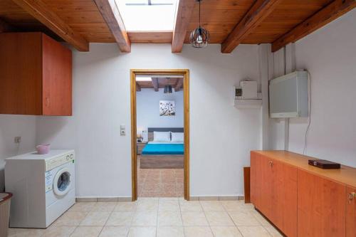 a kitchen with a washing machine in a room at Etia - Venetian Villa 