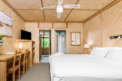 Ένα ή περισσότερα κρεβάτια σε δωμάτιο στο Tallow Beach Motel