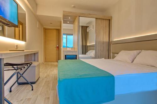 Posteľ alebo postele v izbe v ubytovaní Palmea Hotel