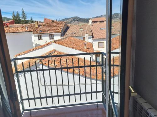 a view of a city from a window at NcantadaROOMS in Tragacete