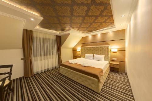 Postel nebo postele na pokoji v ubytování Allegria Hotel