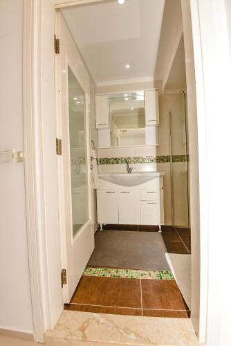 a bathroom with a sink and a mirror at Villa Tia in Ortaca