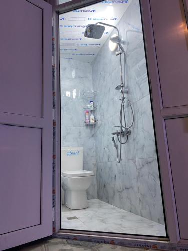 a bathroom with a shower and a toilet at Elite Novkhany-Corat Villa in Corat