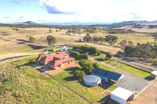 an aerial view of a house in a field at Country Paradise Estate in Hall