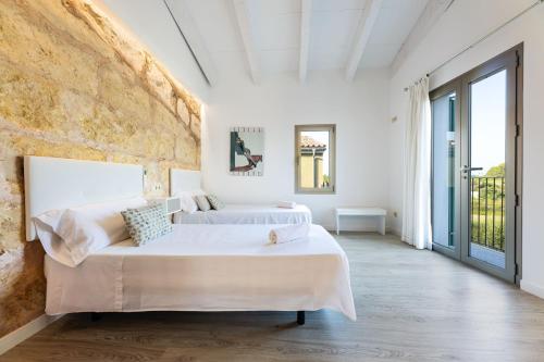 A bed or beds in a room at Holiday Home S'Abellar
