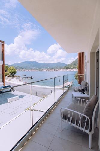 a balcony with a view of the water at Ah Porticcioli Boutique Apartments in San Felice del Benaco
