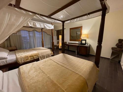 a hotel room with two beds and a mirror at Sheikh coast in Sharm El Sheikh