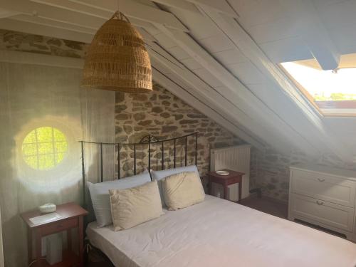 a bedroom with a white bed with a ceiling at Dreamy Cottage in Ayiá