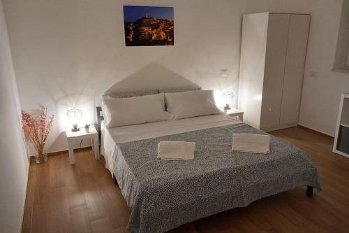 Posteľ alebo postele v izbe v ubytovaní [Verso i Sassi] con parcheggio privato