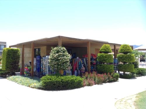 a building with a lot of plants and trees at Pelagos Suites Hotel & Spa in Kos Town