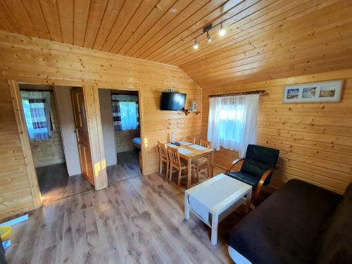 an overhead view of a living room in a log cabin at SEWI Komfortowe domki w Rusinowie in Rusinowo