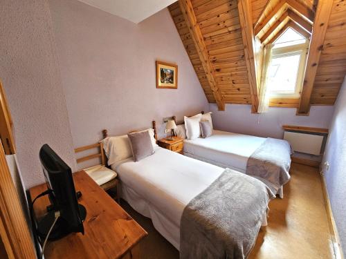 Posteľ alebo postele v izbe v ubytovaní Hotel Anglada