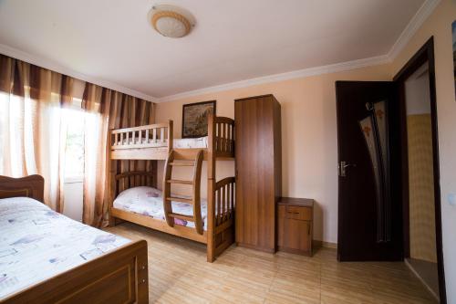 Postel nebo postele na pokoji v ubytování Guest House Rimma