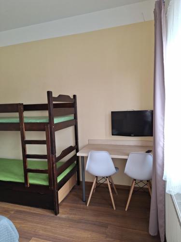 Postel nebo postele na pokoji v ubytování Omega Jantar