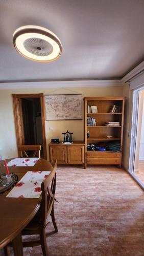 a living room with a table and a dining room at La Manga del Mar Menor Los Miradores block 1 5th floor G in Murcia