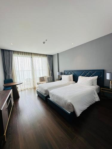 Postel nebo postele na pokoji v ubytování The Cam Ranh Oceanview Resort