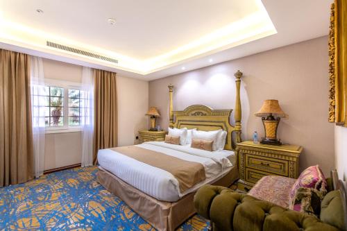 a hotel room with a bed and a couch at Meral Oasis Hotel Villas in Taif