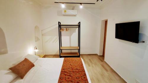 Hotel Casa Sab - San Fernando tesisinde bir odada yatak veya yataklar