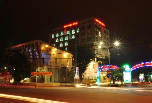 a tall building with lights on it at night at Cam Thanh Hotel in Quang Ngai
