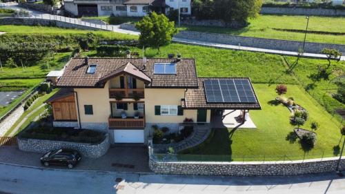 a house with solar panels on the roof at B&B Elisè in Castel Ivano