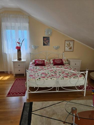 a bedroom with a white bed and a window at Magic Eden Rijeka in Rijeka