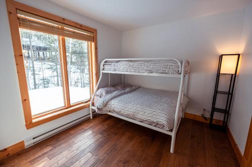 Ein Bett oder Betten in einem Zimmer der Unterkunft Le 583 Stoneham CITQ#239,960