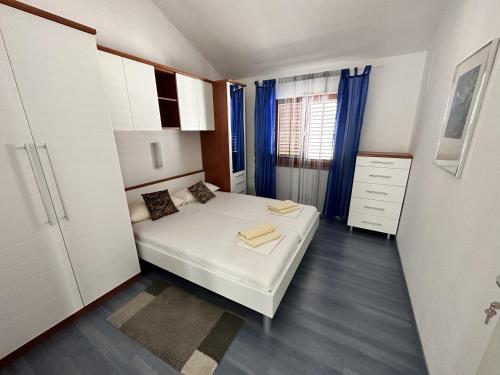 Postel nebo postele na pokoji v ubytování Apartman Gaga