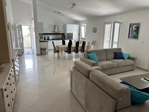 a living room with a couch and a table at Apartman Gaga in Kruševo