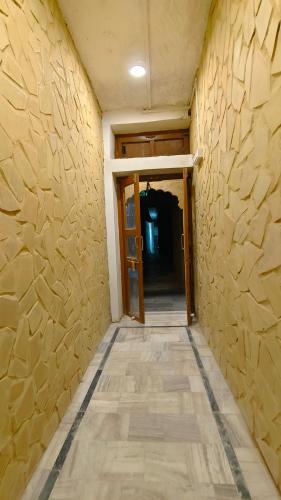 a hallway of a room with a stone wall at Hotel Fort View -The Heart of city in Jaisalmer