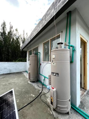 two water heaters are sitting outside of a building at Paradiso Lodge Skardu in Skardu