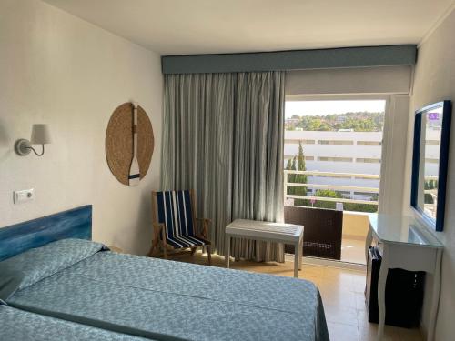 Postel nebo postele na pokoji v ubytování Hostal Roberto