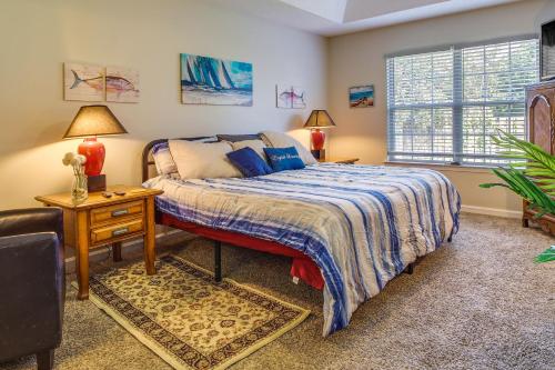 a bedroom with a bed and a chair and a window at Pet-Friendly Savannah Rental with Community Pool! in Savannah