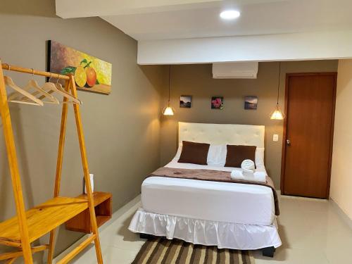 a bedroom with a bed and a ladder in it at Hotel La Casablanca Tayrona in Calabazo
