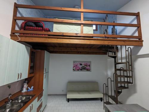 a loft bed in a kitchen with a sink at Sciacca Holiday Home in Sciacca